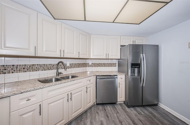 kitchen featuring dark hardwood / wood-style floors, white cabinetry, sink, and appliances with stainless steel finishes