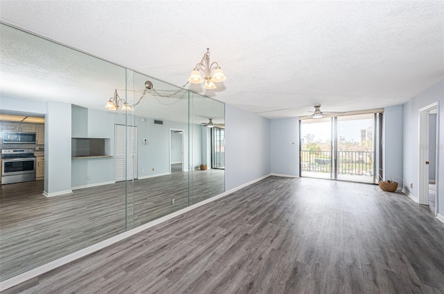 unfurnished living room featuring ceiling fan, wood-type flooring, and a textured ceiling