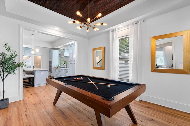 game room featuring wooden ceiling, sink, pool table, light hardwood / wood-style flooring, and a notable chandelier