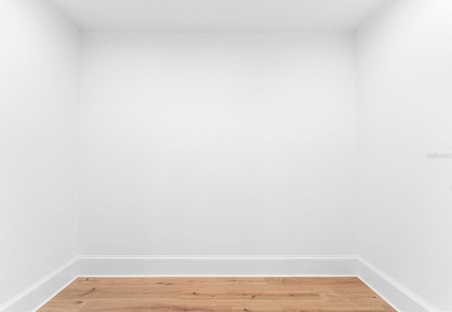 empty room with hardwood / wood-style flooring