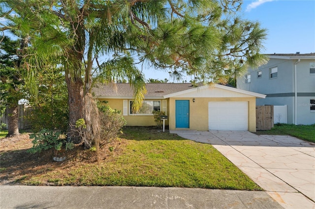 view of front of property featuring a garage and a front yard