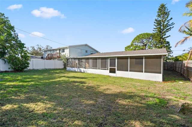 view of yard with a sunroom