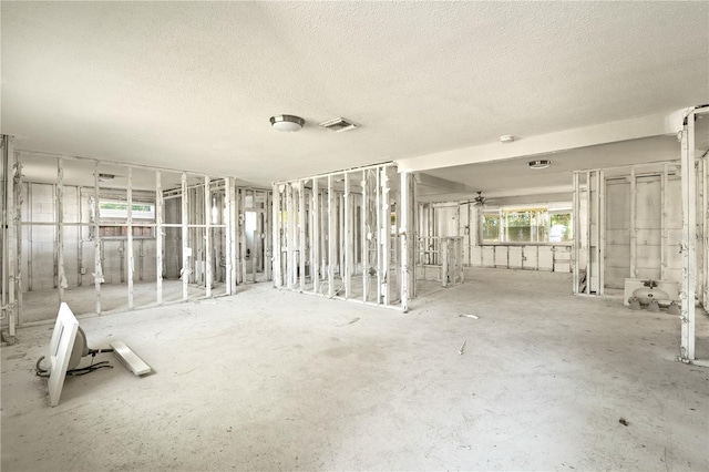 miscellaneous room featuring a textured ceiling