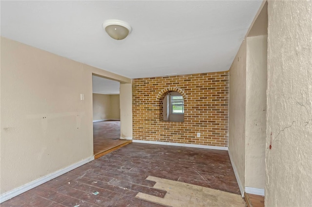 empty room with brick wall