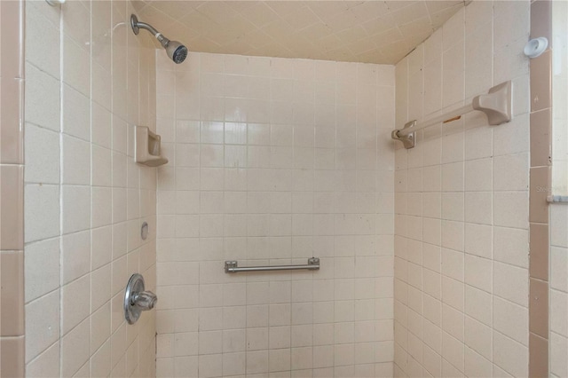 bathroom with a tile shower