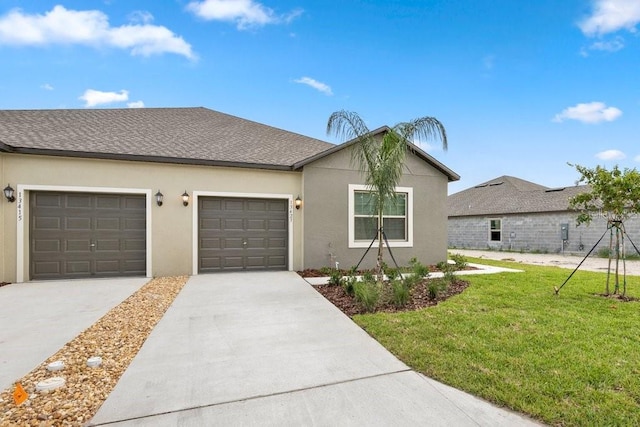 ranch-style home with a front yard and a garage