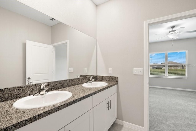 bathroom featuring ceiling fan and vanity