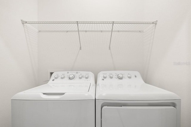 laundry area featuring washing machine and clothes dryer