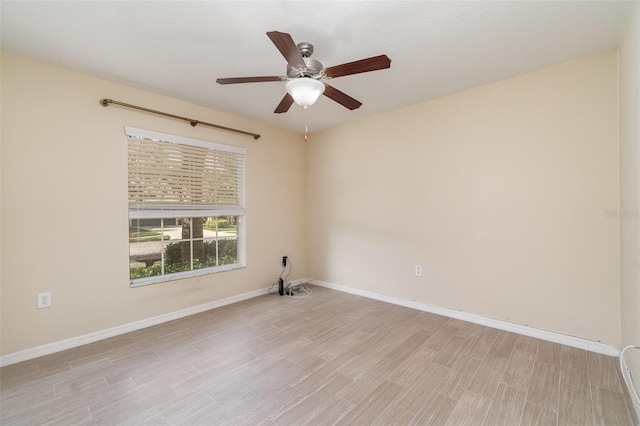 spare room with ceiling fan and light hardwood / wood-style flooring