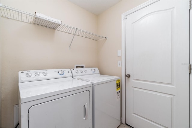 laundry area featuring separate washer and dryer