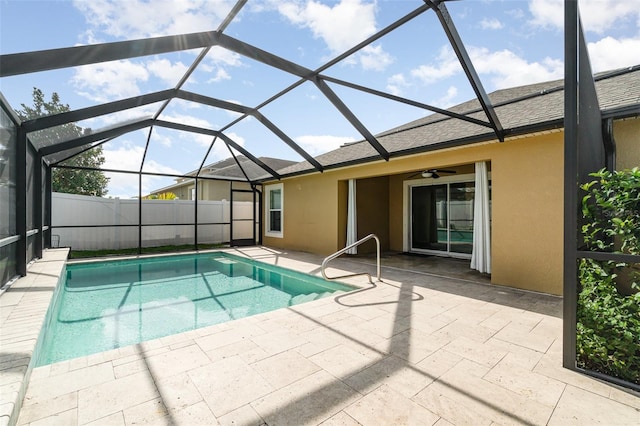 view of pool featuring a lanai, ceiling fan, and a patio