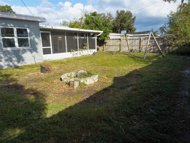 view of yard featuring a sunroom