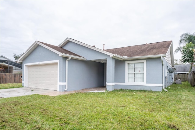 ranch-style house with a garage and a front lawn