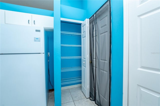 corridor featuring light tile patterned floors