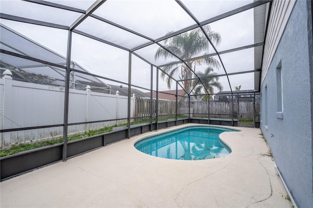 view of pool with a lanai and a patio area