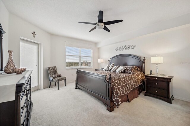 bedroom with light colored carpet and ceiling fan