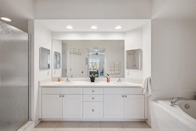 bathroom featuring tile patterned flooring, vanity, and independent shower and bath