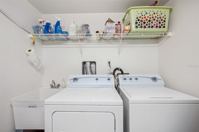 laundry room featuring sink and independent washer and dryer