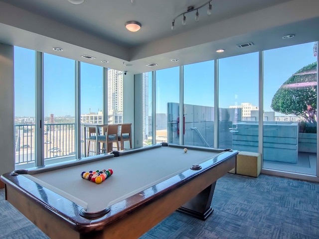 recreation room featuring billiards, a wall of windows, and carpet