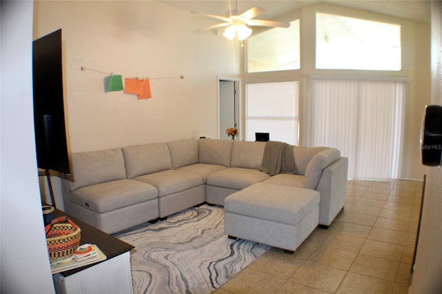 living room featuring high vaulted ceiling, light tile patterned flooring, and ceiling fan