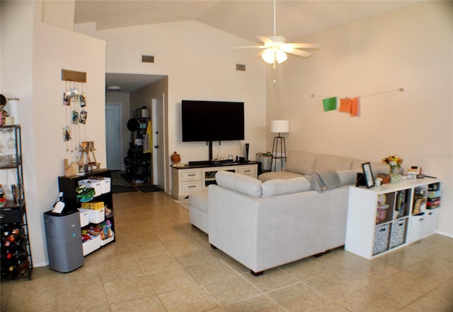 tiled living room with high vaulted ceiling and ceiling fan