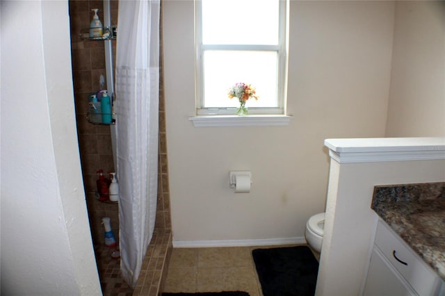 bathroom with toilet, vanity, a shower with shower curtain, and tile patterned flooring