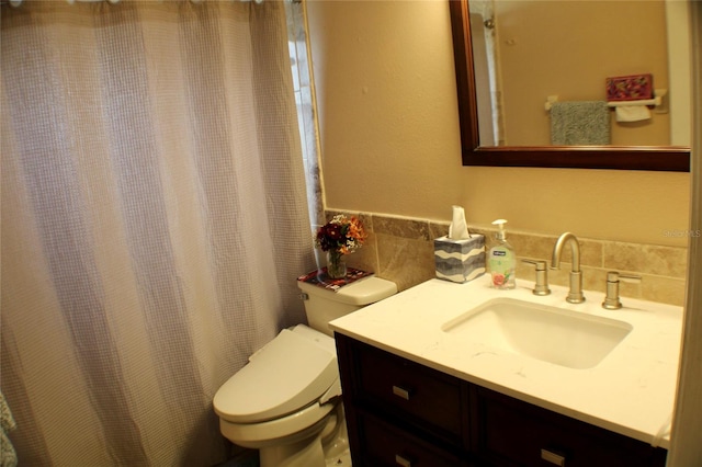 bathroom with toilet and vanity