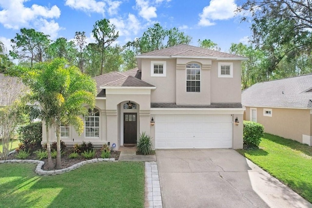 view of front facade featuring a front yard and a garage