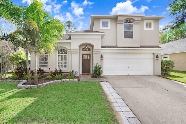 view of front of house with a front lawn and a garage