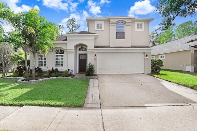 view of front of house with a front lawn and a garage