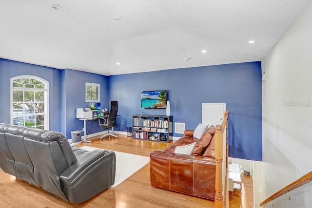 living room with light hardwood / wood-style flooring