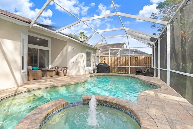 view of pool featuring an in ground hot tub, a patio, a grill, and a lanai