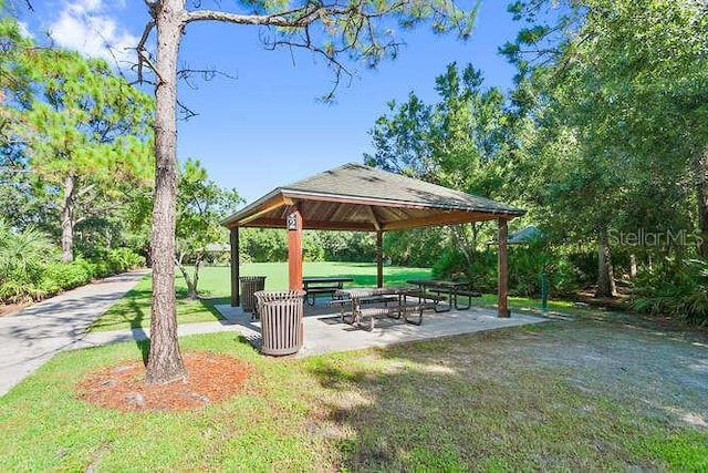 surrounding community featuring a gazebo and a yard