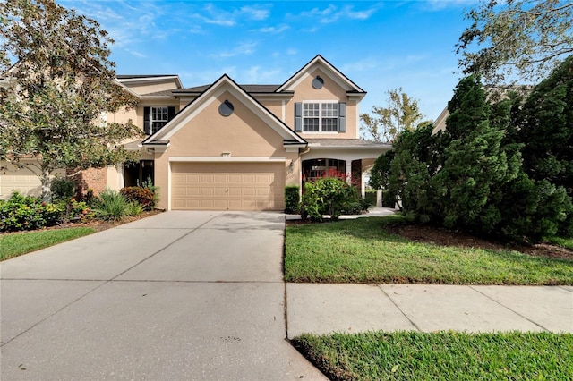 view of front of home featuring a garage and a front yard