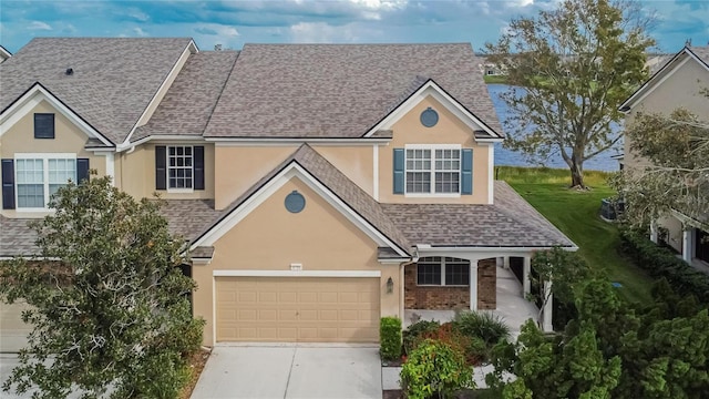 view of front of property with a garage and a front yard