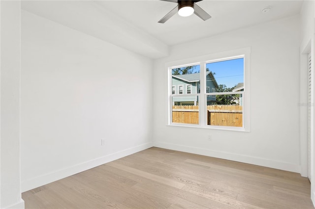 unfurnished room featuring light wood-type flooring and ceiling fan