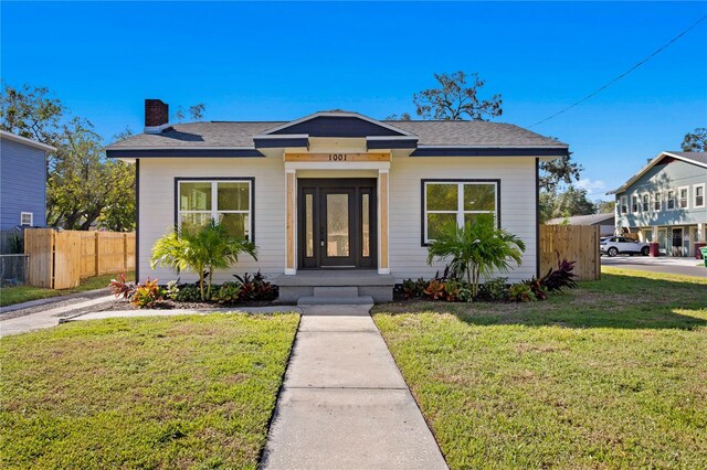 bungalow with a front lawn