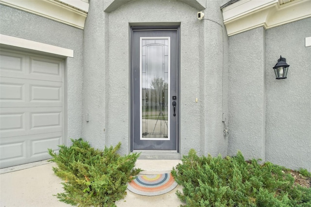 entrance to property featuring a garage