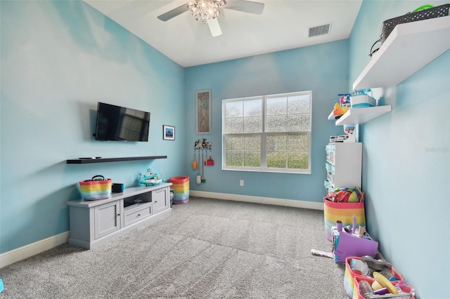 recreation room featuring light colored carpet and ceiling fan