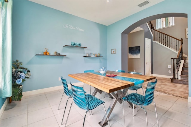 dining space with light hardwood / wood-style floors