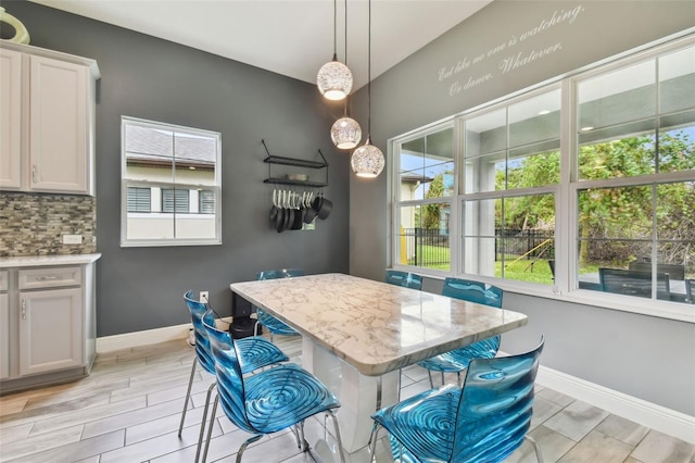 dining area with light hardwood / wood-style flooring