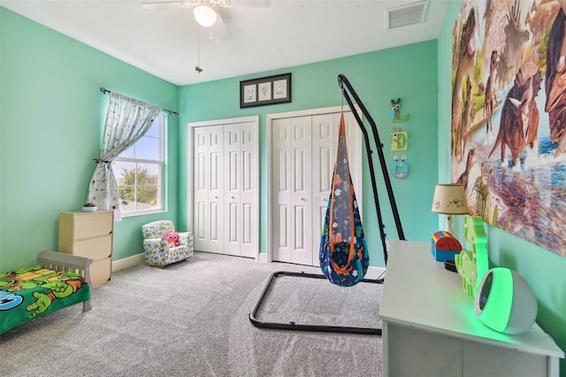 playroom featuring ceiling fan and carpet floors