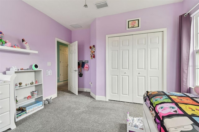 carpeted bedroom with a closet