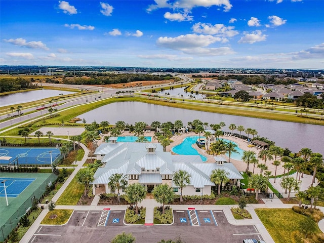 birds eye view of property with a water view