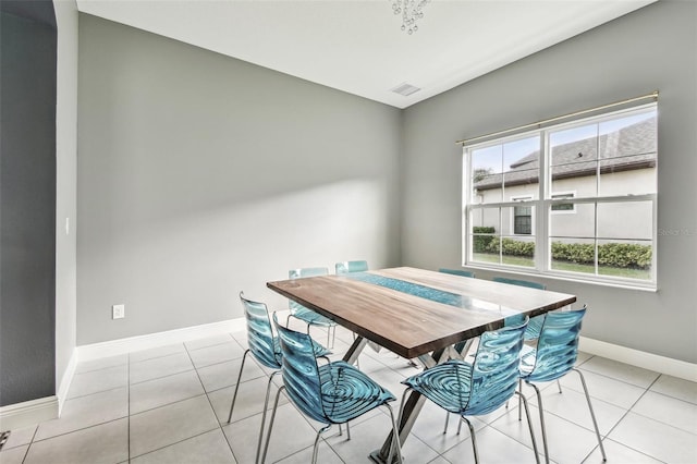 6317 Brevada Ln, Apollo Beach, FL 33572 - dining area with light tile patterned floors and baseboards