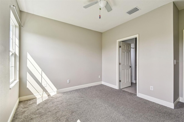 6317 Brevada Ln, Apollo Beach, FL 33572 - carpeted spare room featuring a ceiling fan, plenty of natural light, and baseboards
