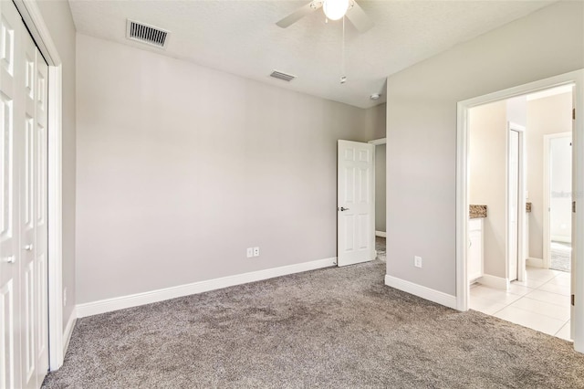 6317 Brevada Ln, Apollo Beach, FL 33572 - unfurnished bedroom with carpet floors, a closet, baseboards, and ceiling fan