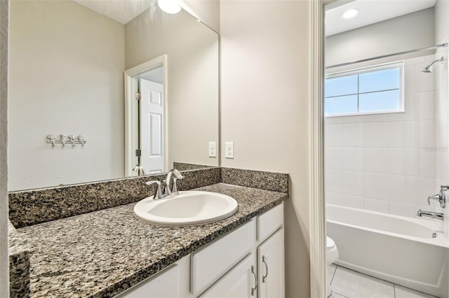 6317 Brevada Ln, Apollo Beach, FL 33572 - full bathroom with vanity, toilet, washtub / shower combination, and tile patterned flooring