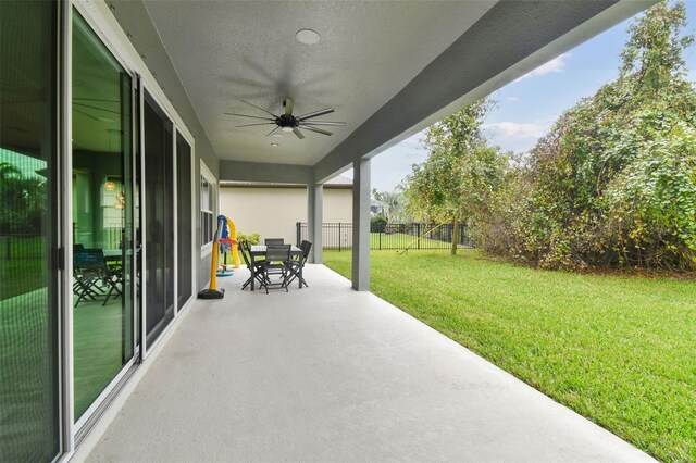 6317 Brevada Ln, Apollo Beach, FL 33572 - view of patio / terrace with a ceiling fan and outdoor dining space