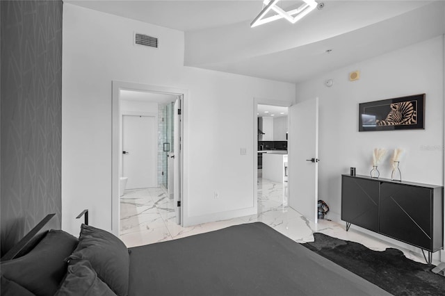 bedroom featuring ensuite bath